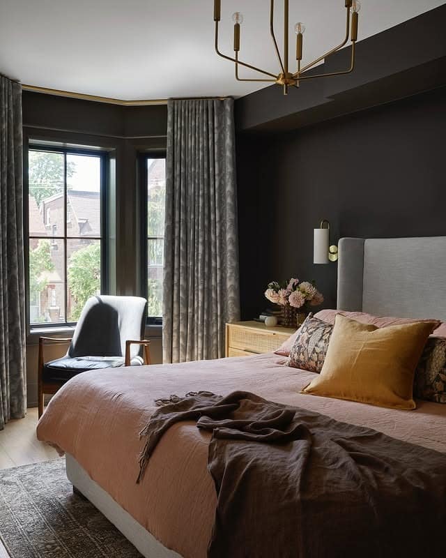 16. Espresso Brown Bedroom with Soft Blush Bedding and Brass Chandelier - moody bedroom ideas
