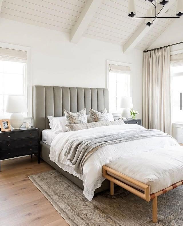 5. Vaulted Ceiling Bedroom with Classic Cream Layers - serene bedroom ideas