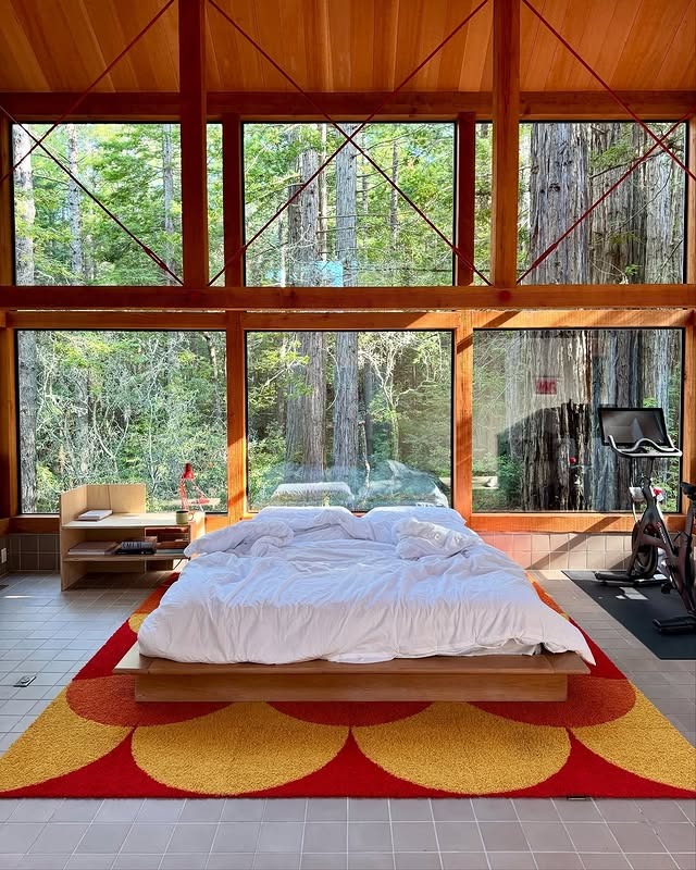 6. Modern Cabin Bedroom with Panoramic Forest Views - serene bedroom ideas