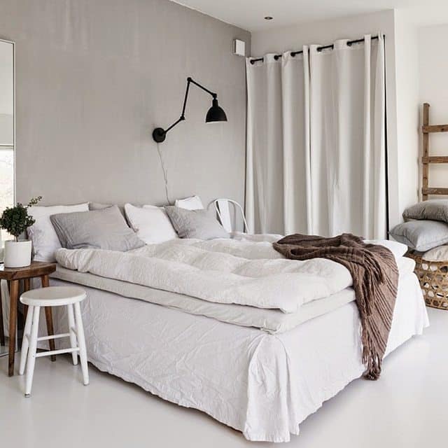 13. Minimal White Bedroom with Soft Gray Accent Wall - serene bedroom ideas
