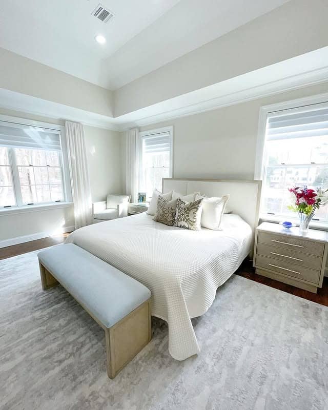 15. Bright Neutral Bedroom with Vaulted Ceiling and Soft Textures - serene bedroom ideas