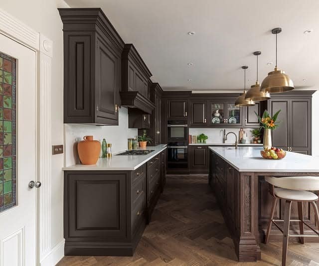 2. Deep Espresso Traditional Kitchen with Brass Lighting - brown kitchen ideas