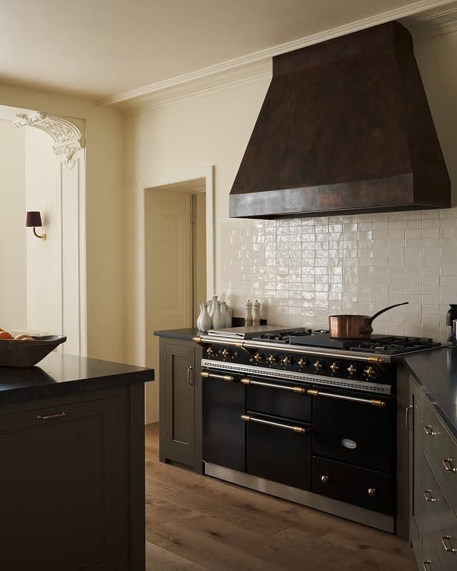 10. Classic Brown Kitchen with Statement Range Hood - brown kitchen ideas