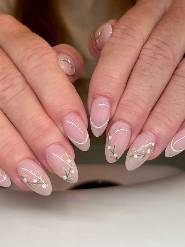 4. Sheer Pink Almond Nails with Delicate Floral Details - minimalist nail ideas