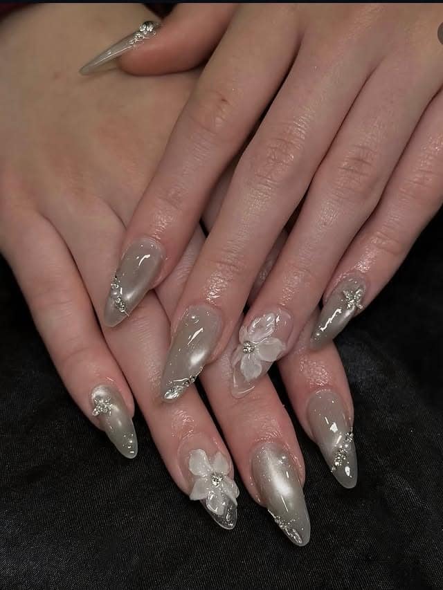 11. Smoky Grey Chrome Stiletto Nails with Crystal and 3D Floral Accents - minimalist nail ideas