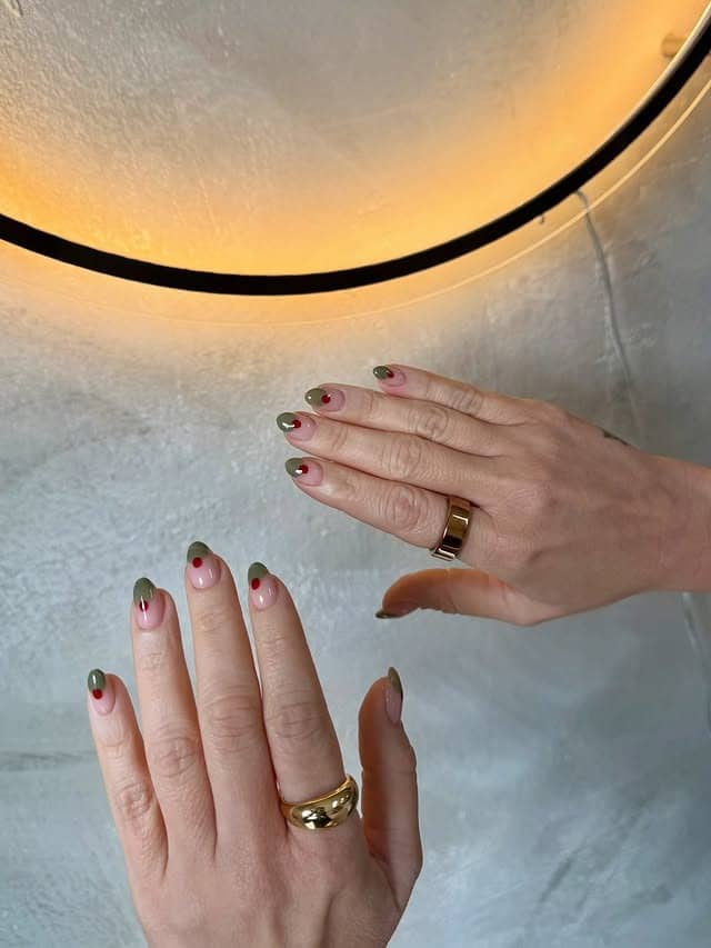 12. Sheer Pink Almond Nails with Olive Green Tips and Red Dot Accents - minimalist nail ideas