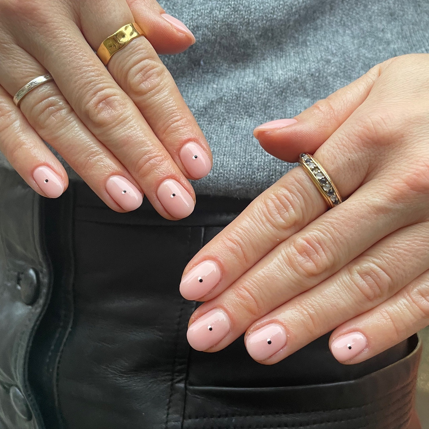 18. Pale Pink Short Oval Nails with Minimal Black Dot Accents - minimalist nail ideas