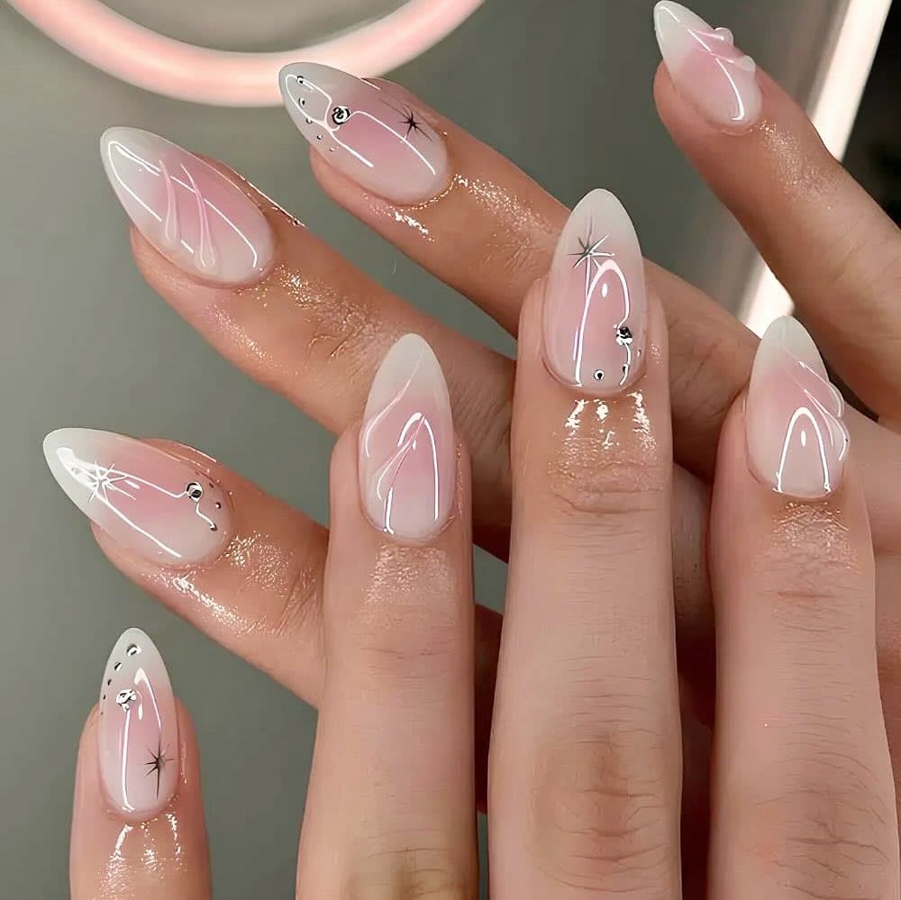 22. Sheer Pink Almond Nails with White Line Art and Subtle Crystal Accents - minimalist nail ideas