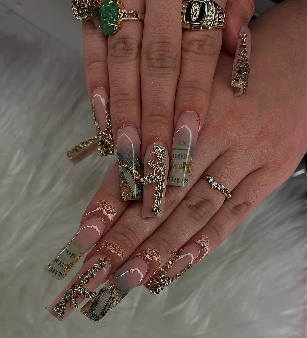 3. Nude Coffin Money Nails with Gold Gun Charms and Dollar Details - money nail ideas