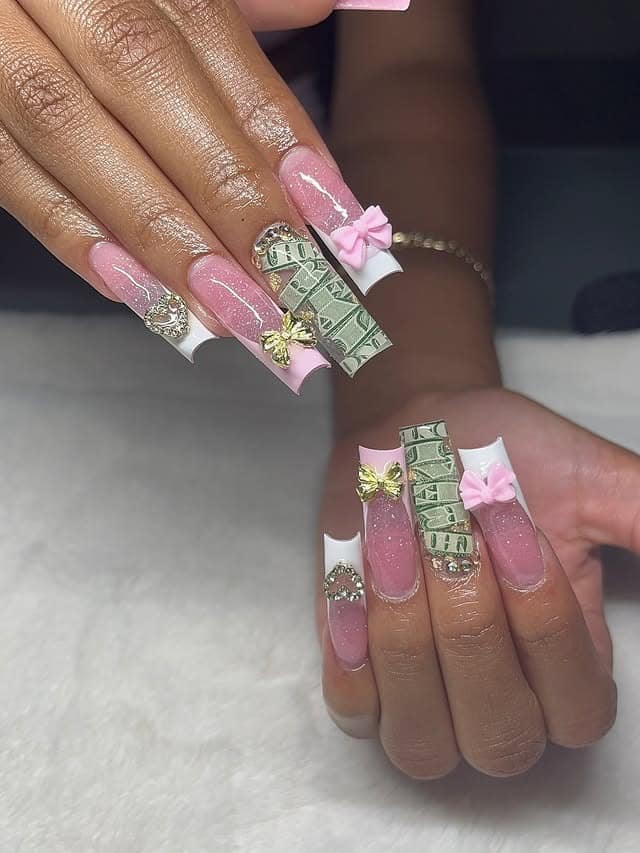 4. Pink French Money Nails with Bow Charms and Dollar Accent - money nail ideas
