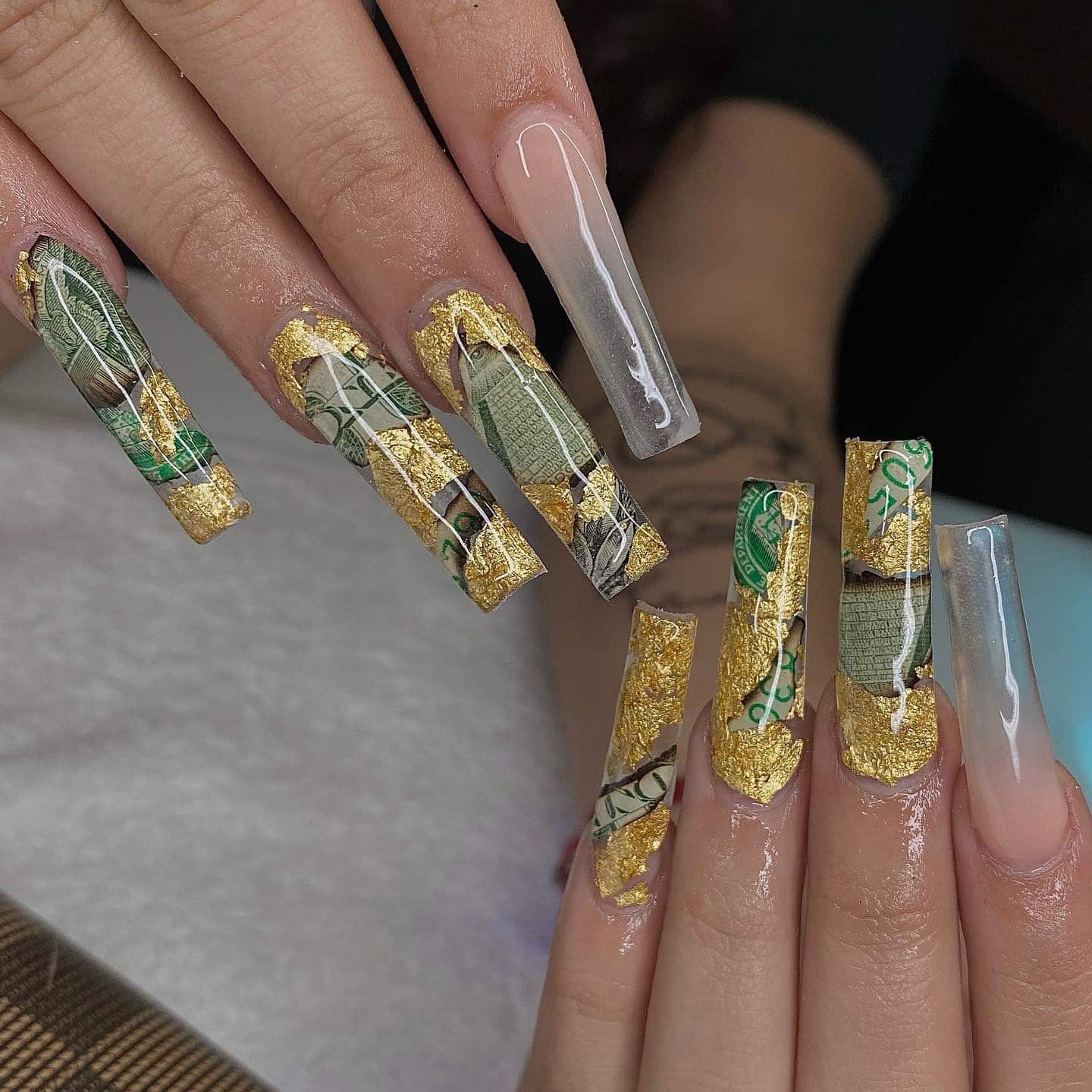 5. Clear Acrylic Money Nails with Gold Leaf and Currency Fragments - money nail ideas