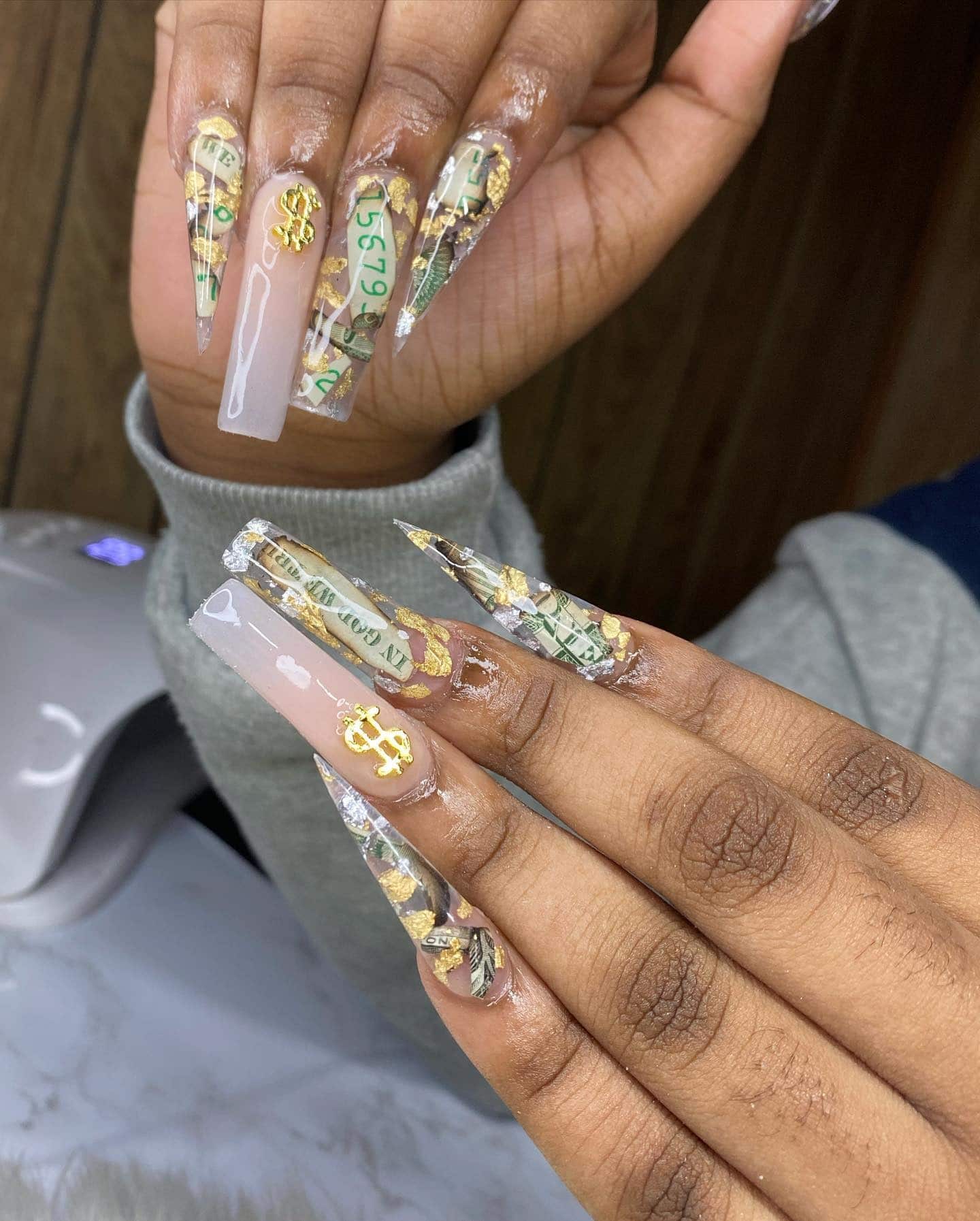 13. Extra Long Stiletto Money Nails with Gold Foil and Dollar Charm - money nail ideas
