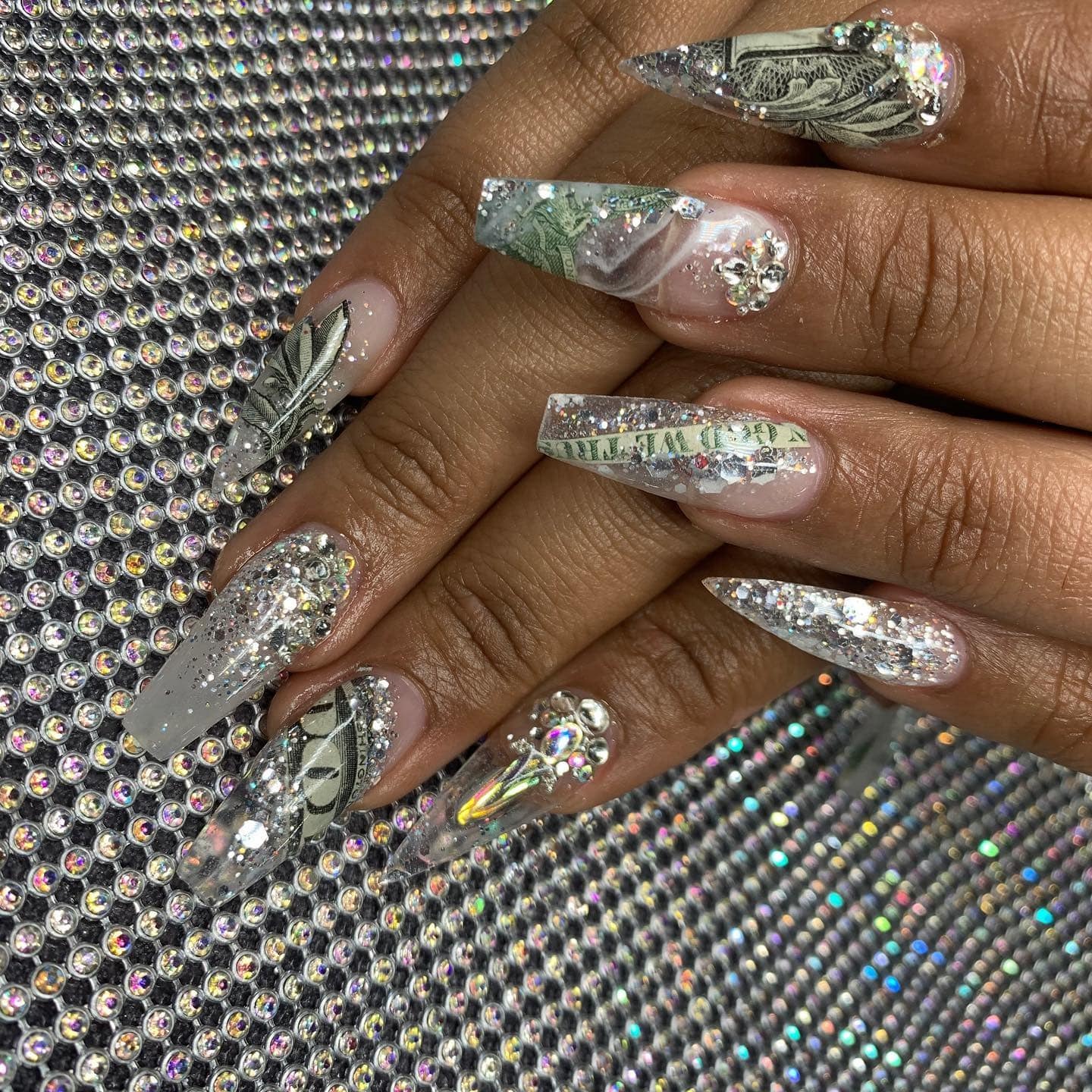 15. Silver Glitter Stiletto Money Nails with Crystal Clusters - money nail ideas