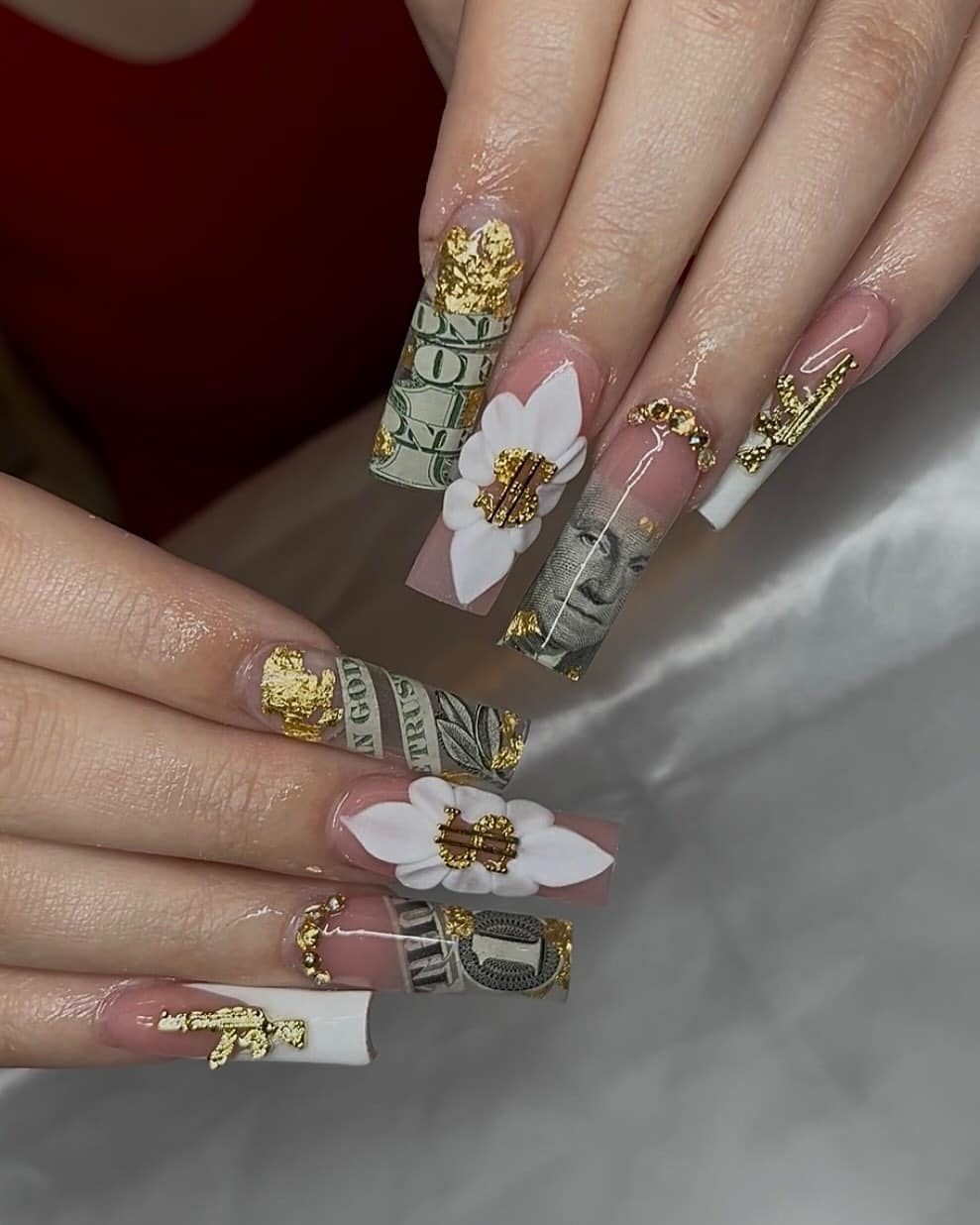 18. Nude Coffin Money Nails with White Flower Charms and Gold Accents - money nail ideas