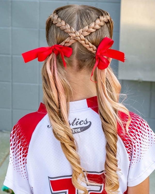 3. Crisscross Dutch Braids with Ribbon-Tied Ponytails - Softball Hairstyles