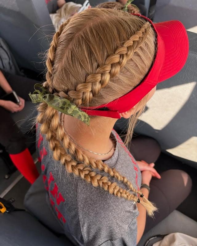 6. Double Dutch Braids with Athletic Visor Finish - Softball Hairstyles