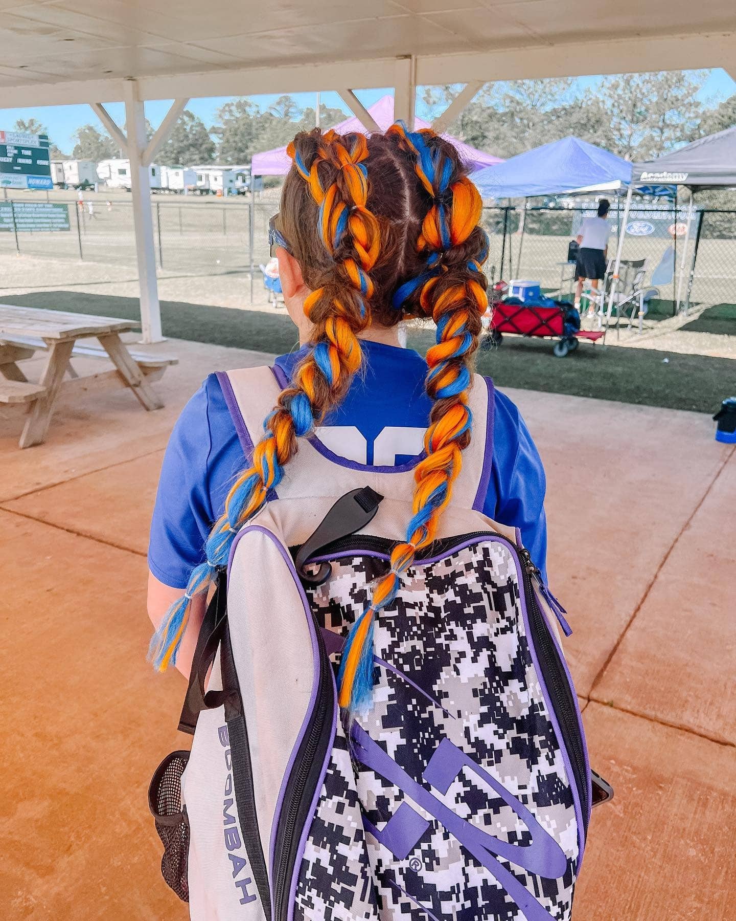 9. Two-Tone Blue and Orange Softball Braids - Softball Hairstyles