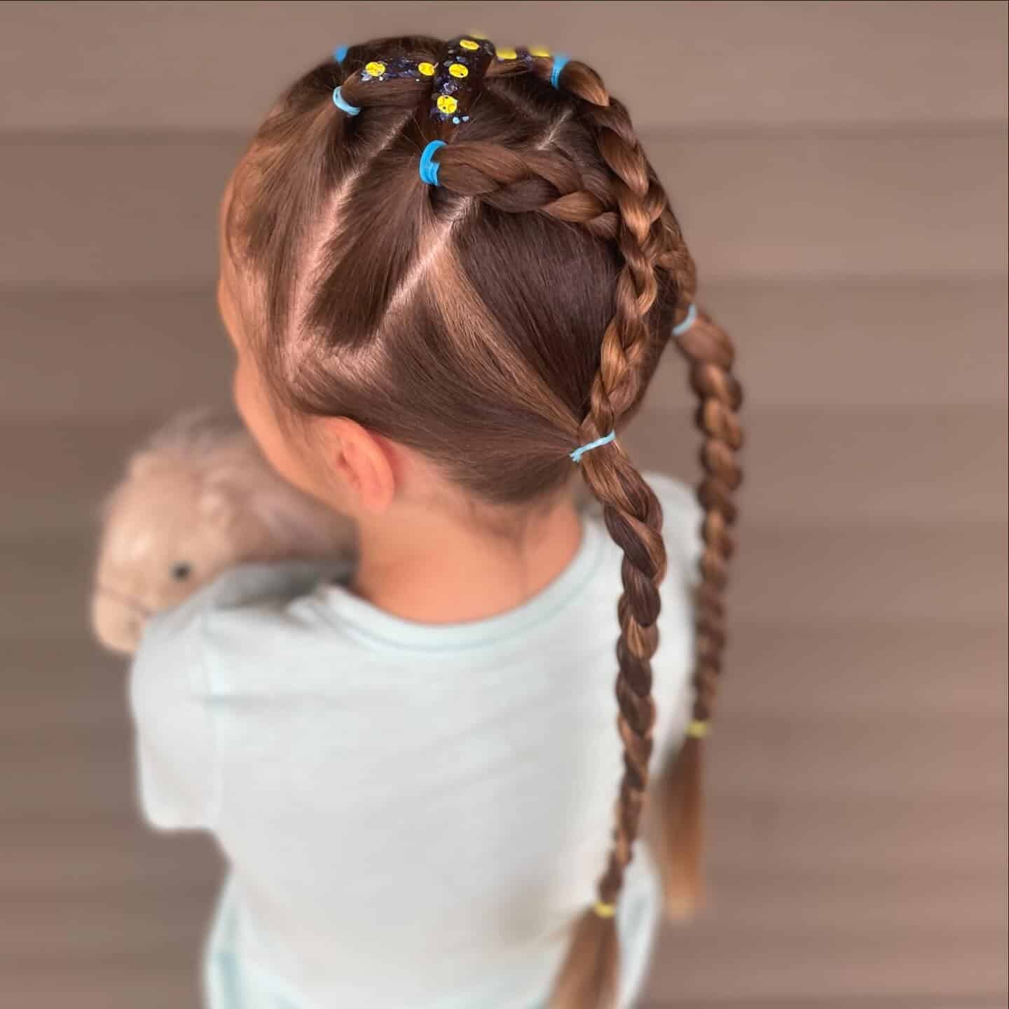 10. Geometric Elastic Braids with Double Ponytail Plaits - Softball Hairstyles