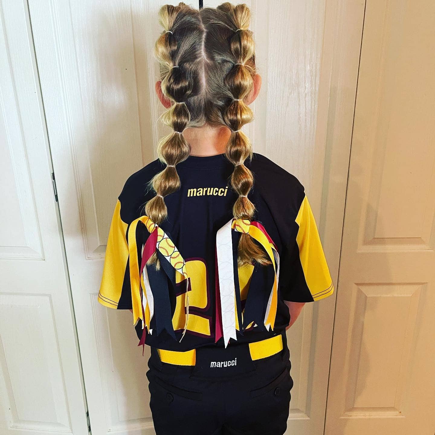 12. Double Bubble Braids with Softball Ribbon Accents - Softball Hairstyles