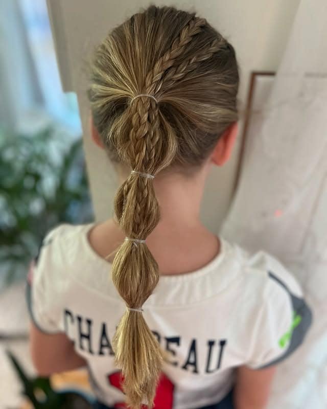 21. Dutch Braid Ponytail with Blonde Bubble Sections - Softball Hairstyles