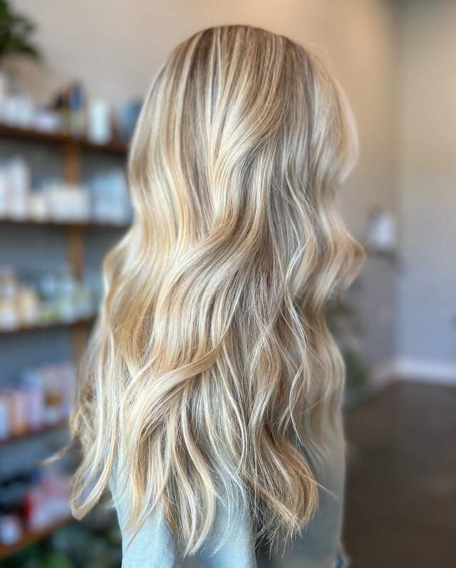 2. Creamy Champagne Blonde with Lived-In Waves - Light Hair Color