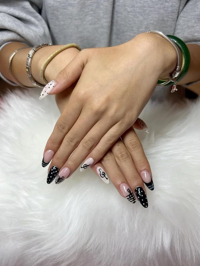 3. Neutral and Black Musical French Tip Nails - music nail ideas