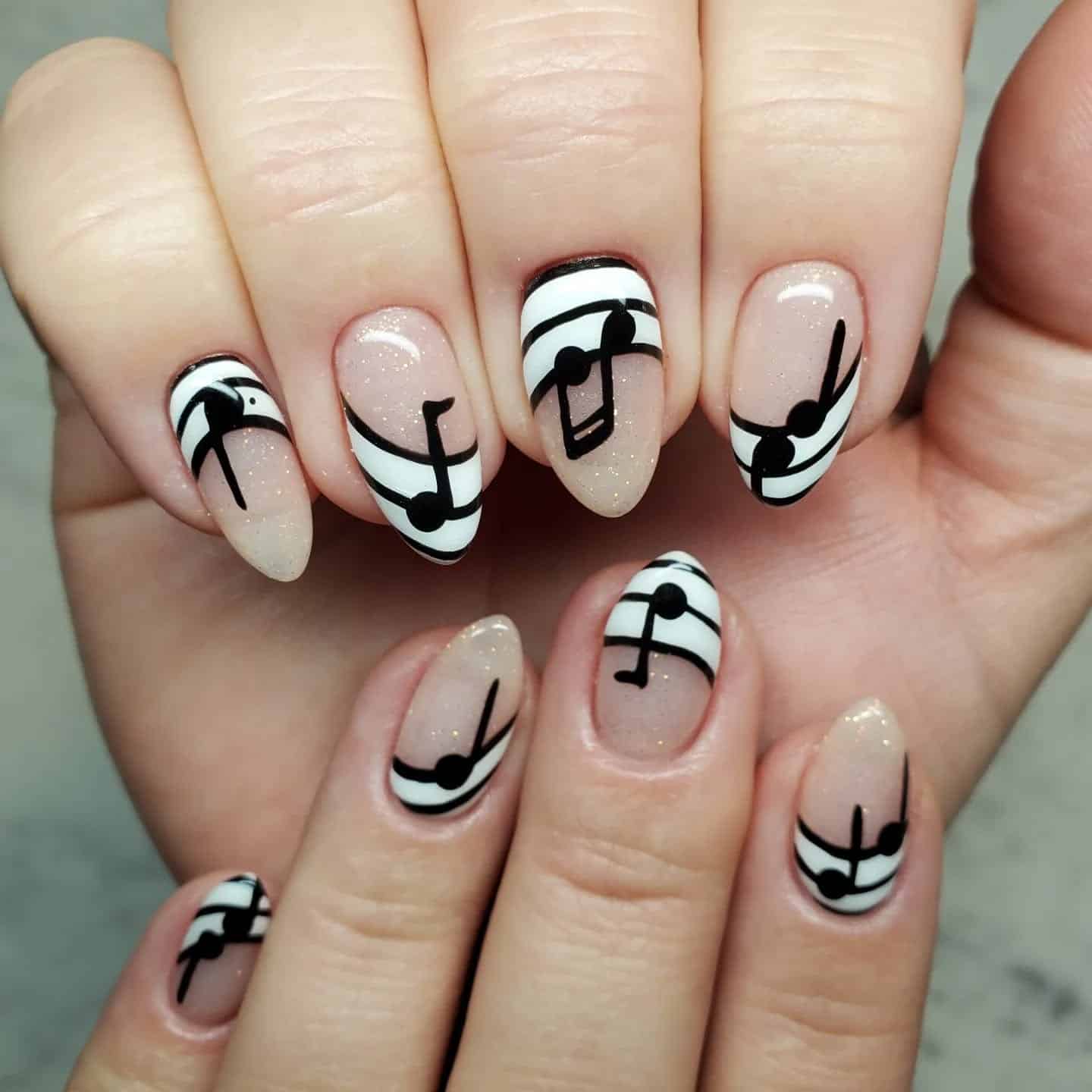 5. Minimalist Music Staff Almond Nails - music nail ideas