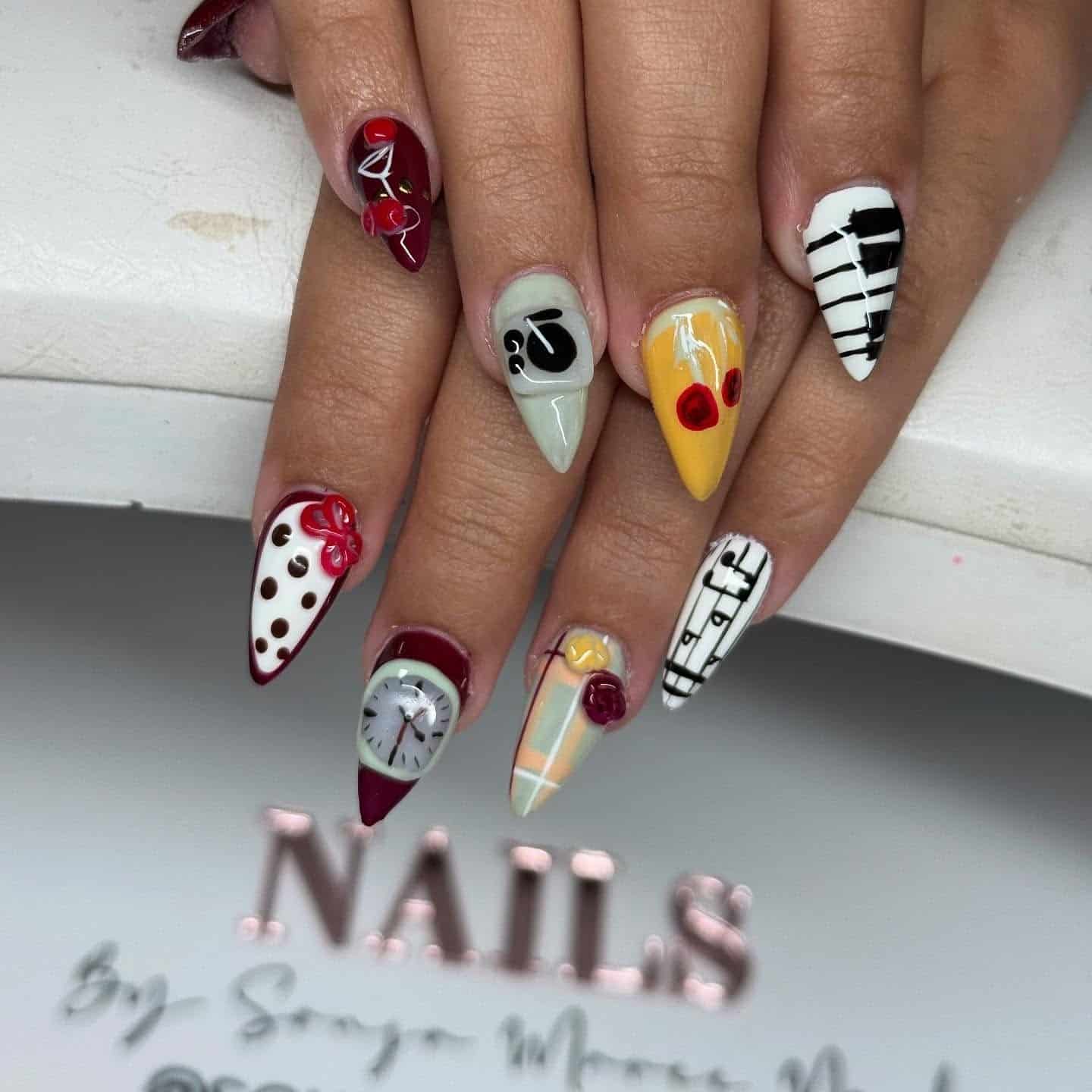 7. Mixed Art Music Theme Stiletto Nails - music nail ideas