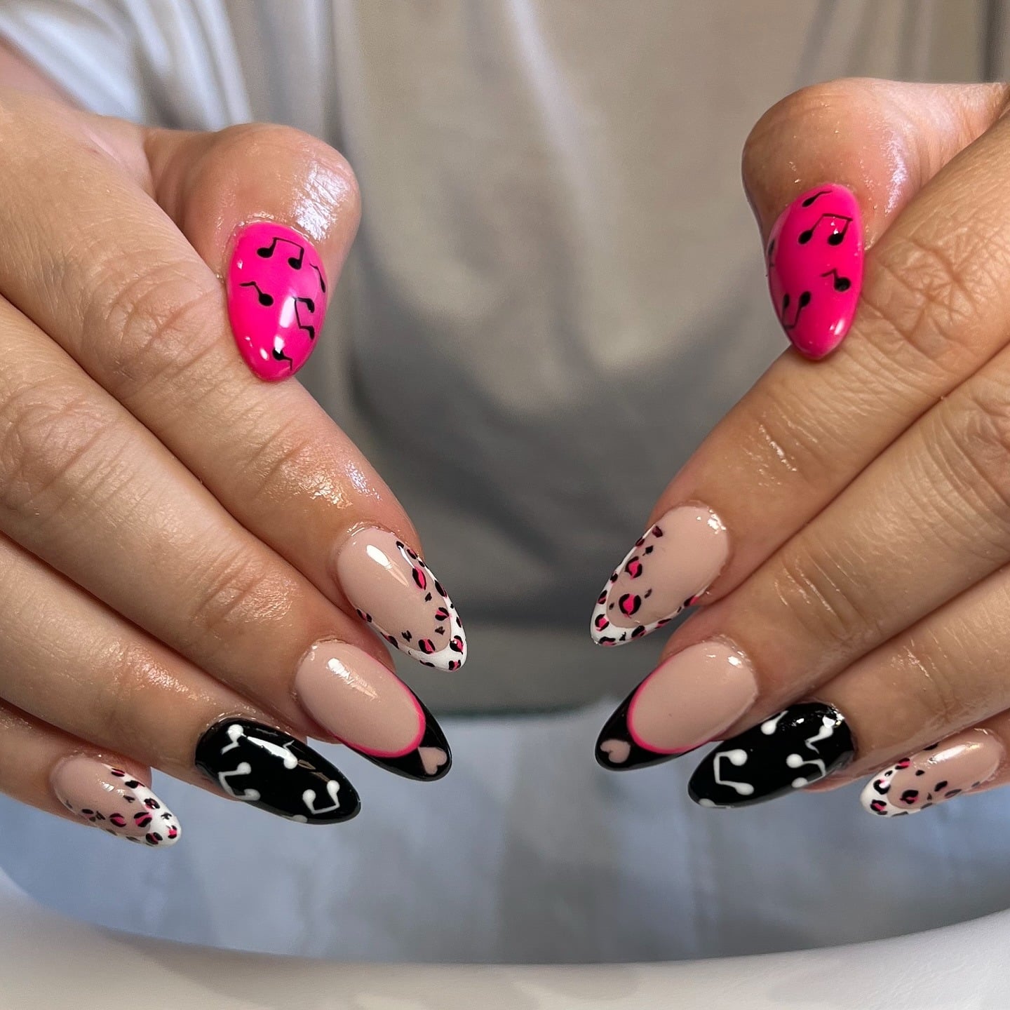 8. Neon Pink Music Note Almond Nails - music nail ideas