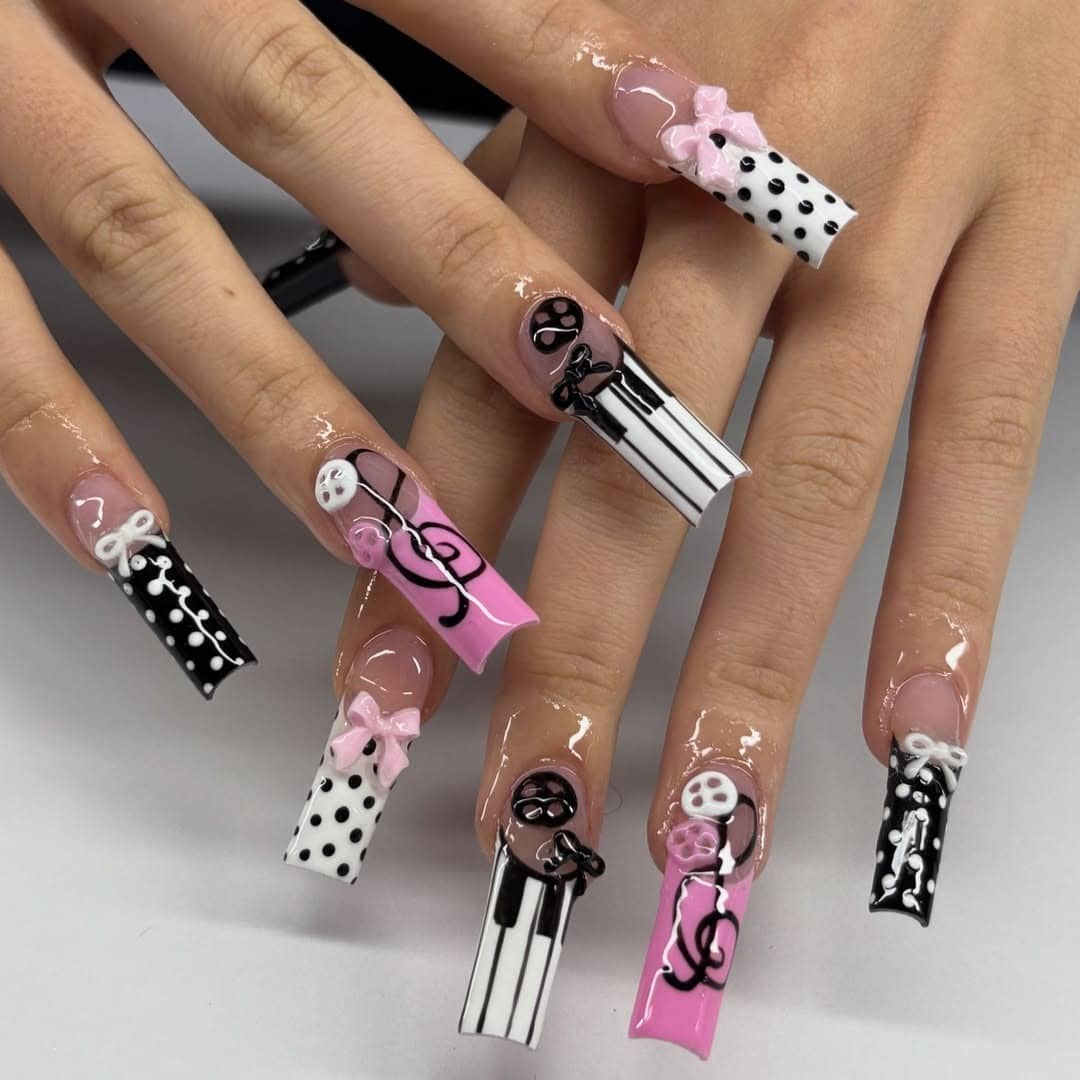 11. Pink, Black, and White 3D Bow Piano Key Coffin Nails - music nail ideas
