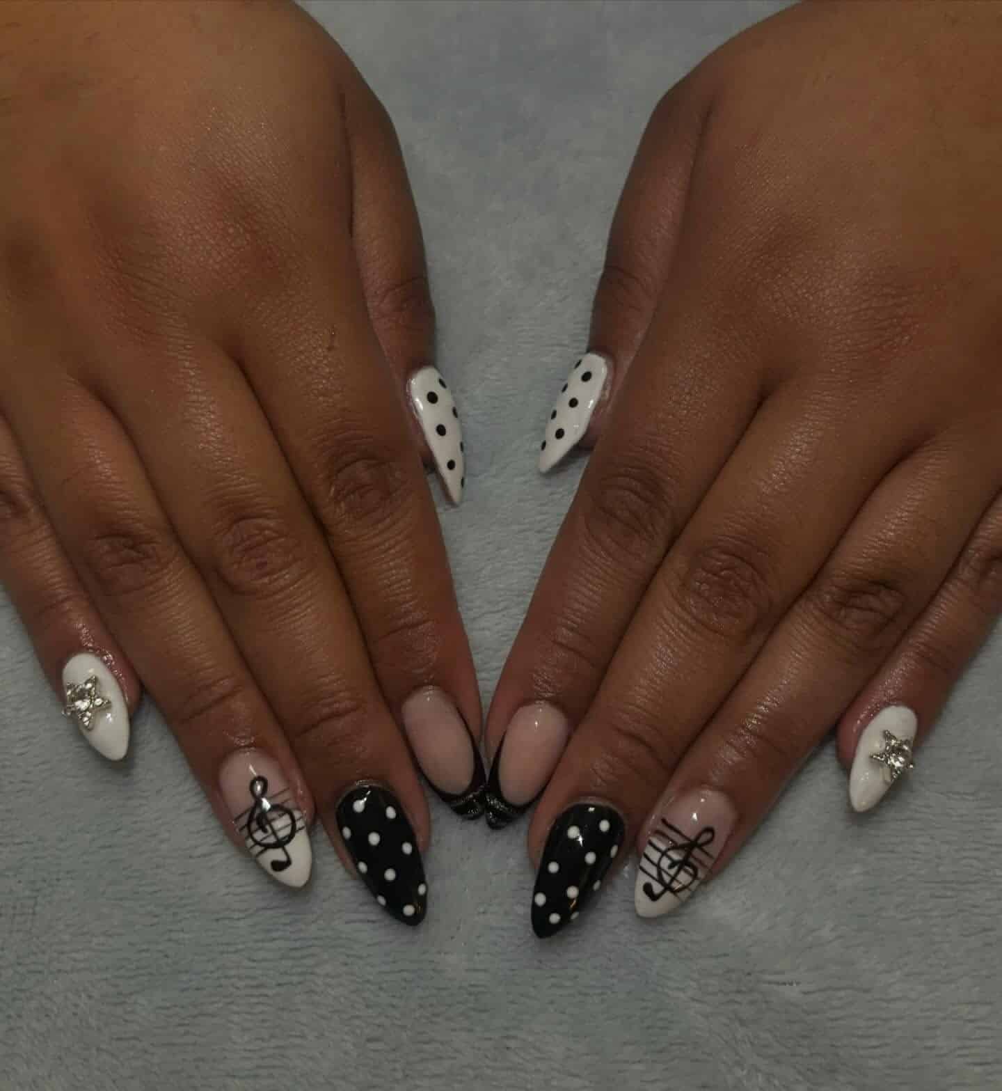 13. Black and White Polka Dot Music Accent Almond Nails - music nail ideas