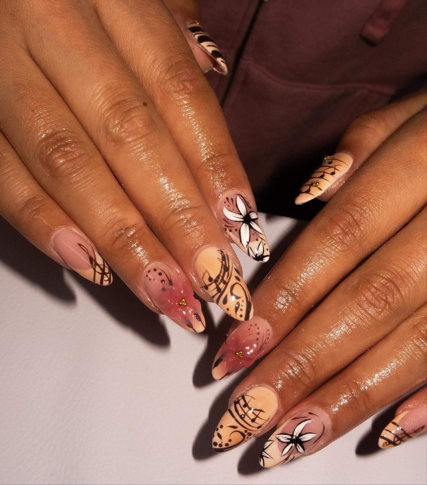 14. Nude and Blush Floral Music Art Almond Nails - music nail ideas