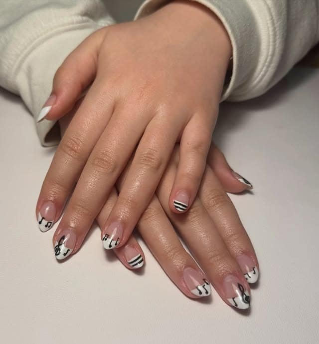 15. White French Tip Music Note Almond Nails - music nail ideas