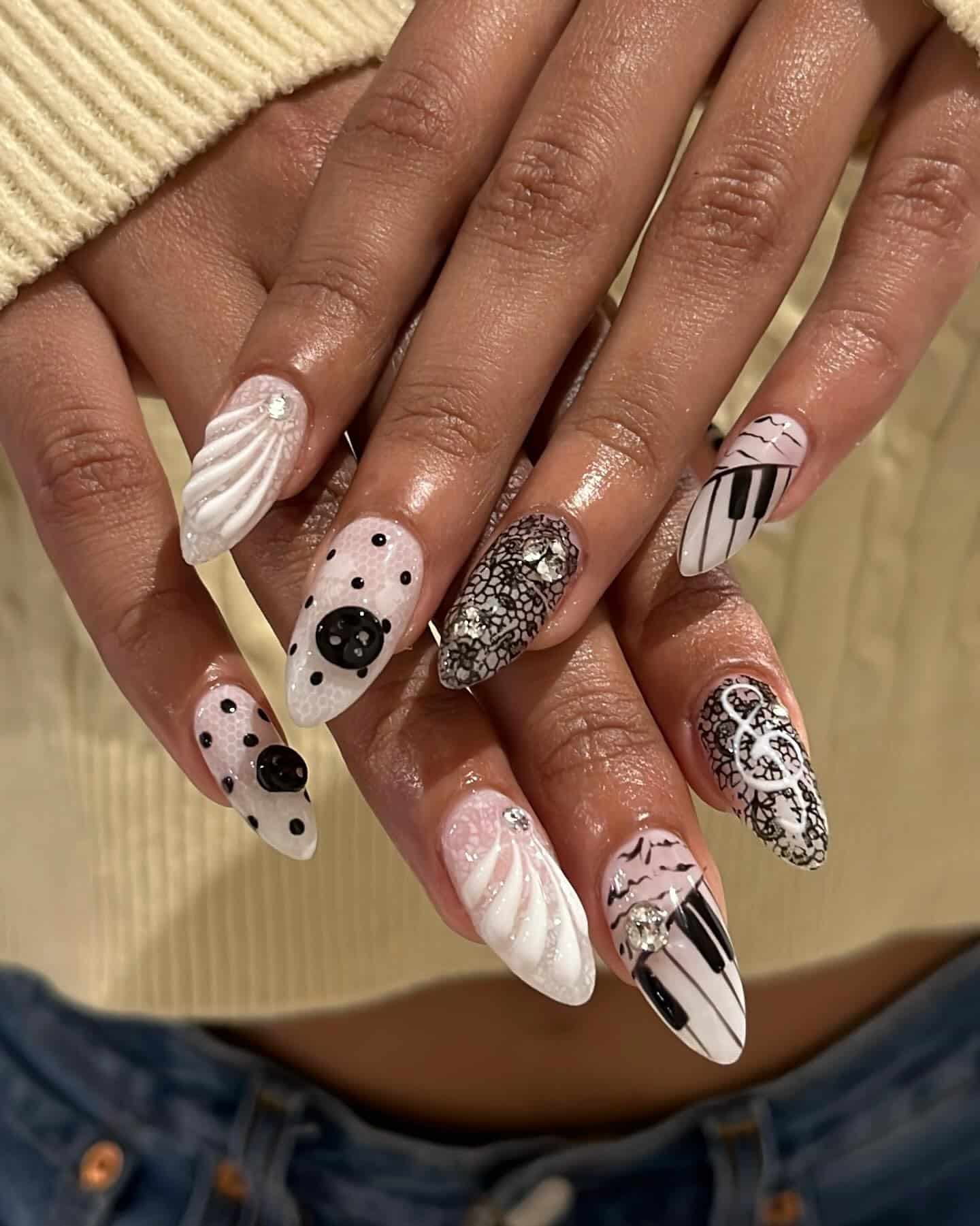17. White and Black Textured Music Art Almond Nails - music nail ideas