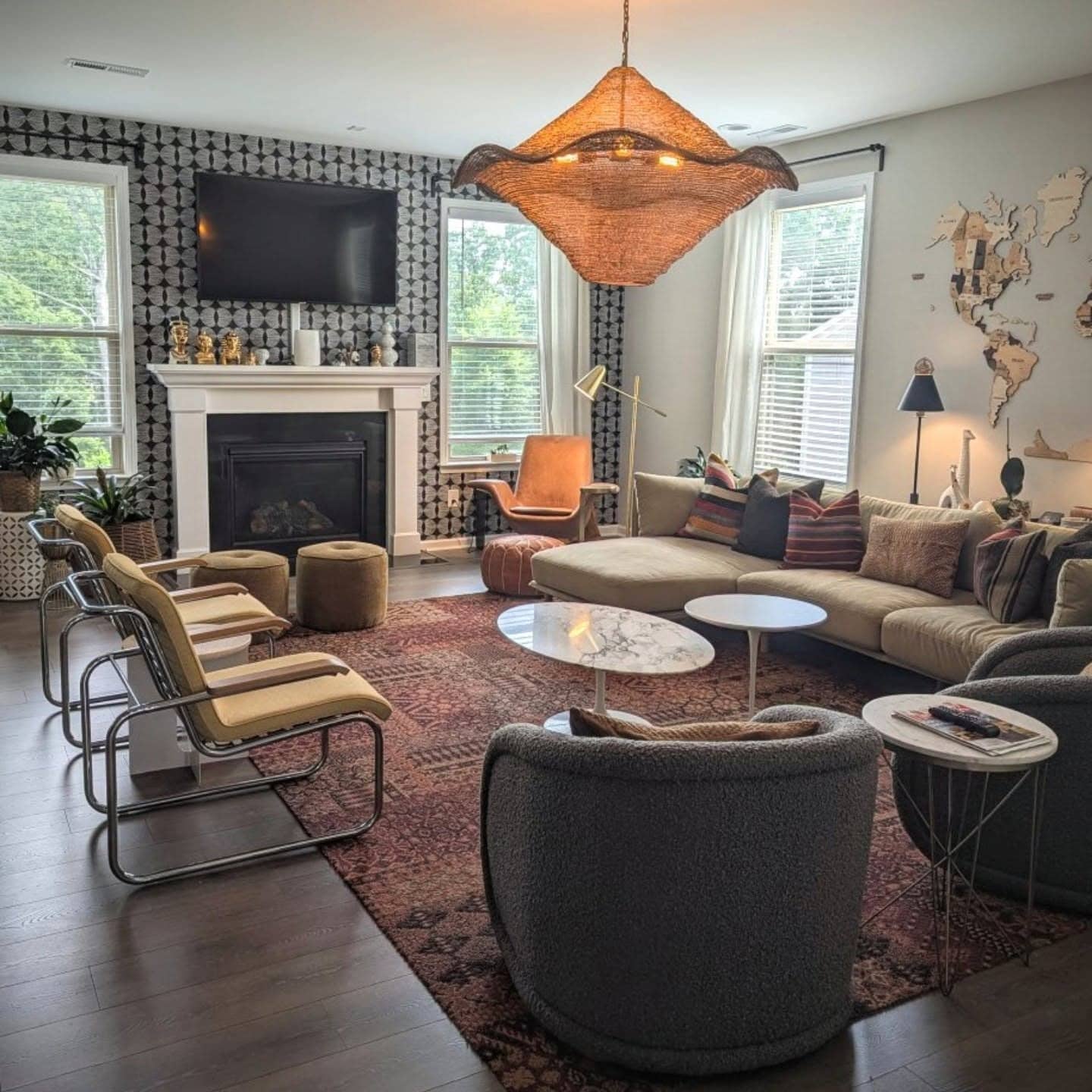 1. Layered Earth Tone Living Room with Patterned Accent Wall - earth tones living room ideas