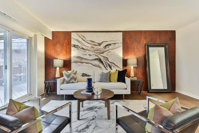 5. Terracotta Accent Wall Living Room with Warm Earth Tone Styling - earth tones living room ideas