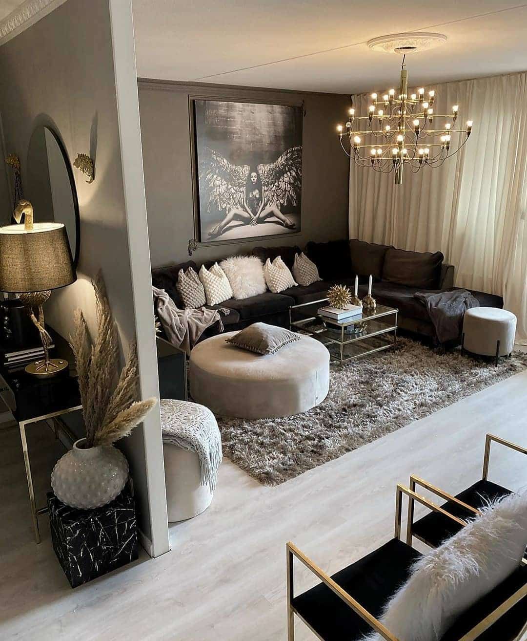 11. Taupe and Chocolate Living Room with Glam Lighting - earth tones living room ideas