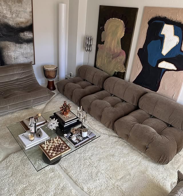 16. Taupe Textured Living Room with Sculptural Seating - earth tones living room ideas