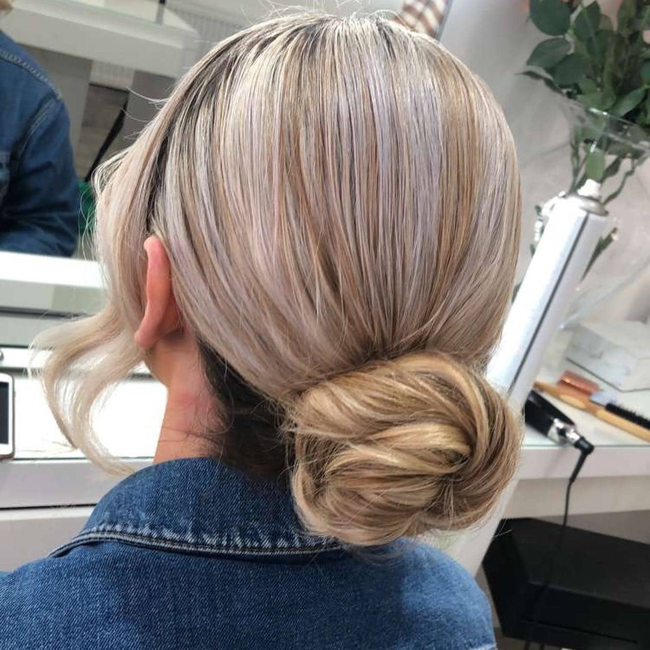 4. Ash Blonde Sleek Low Chignon - Elegant Hairstyles