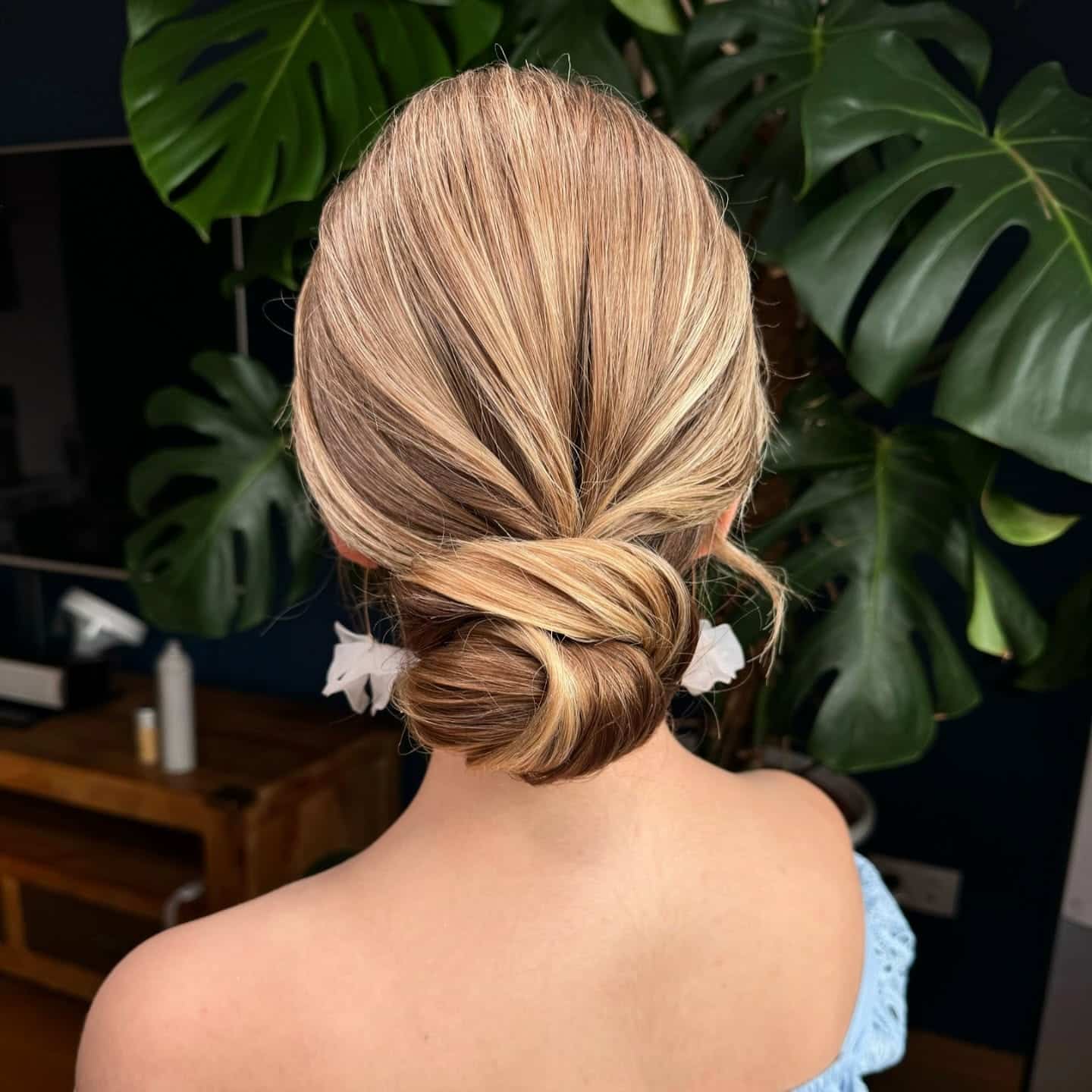 5. Golden Blonde Wrapped Low Bun - Elegant Hairstyles