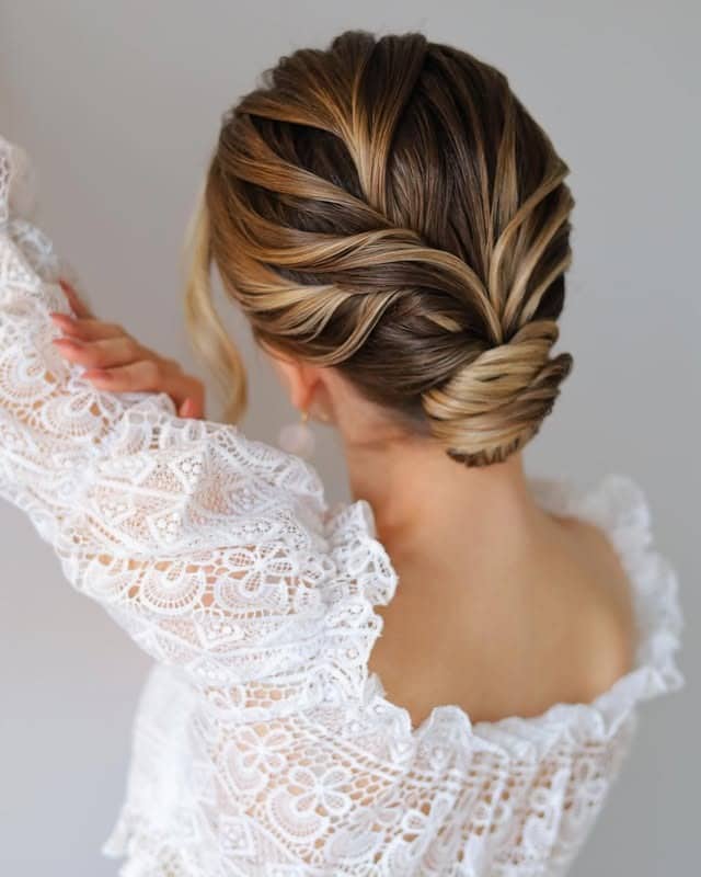 7. Dimensional Brunette Braided Low Bun - Elegant Hairstyles