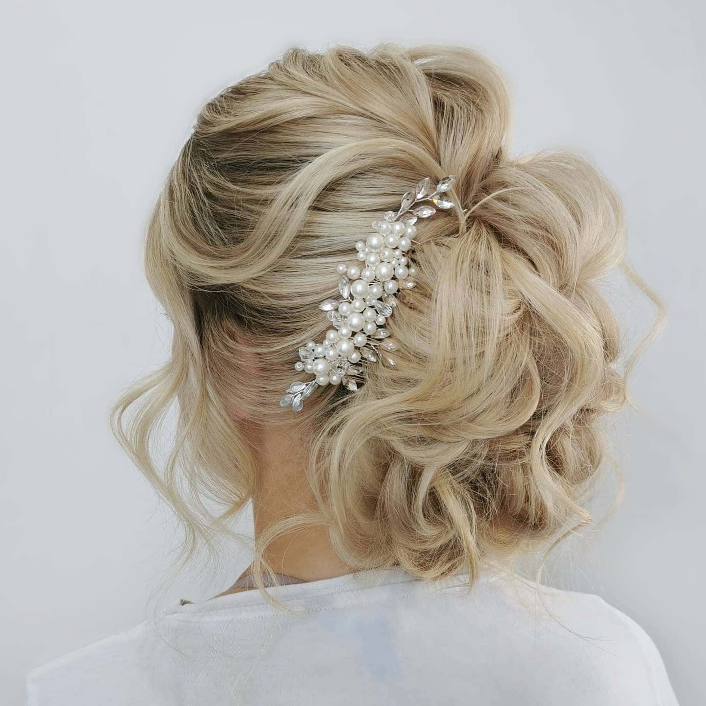 9. Platinum Blonde Pearl-Adorned Textured Bun - Elegant Hairstyles