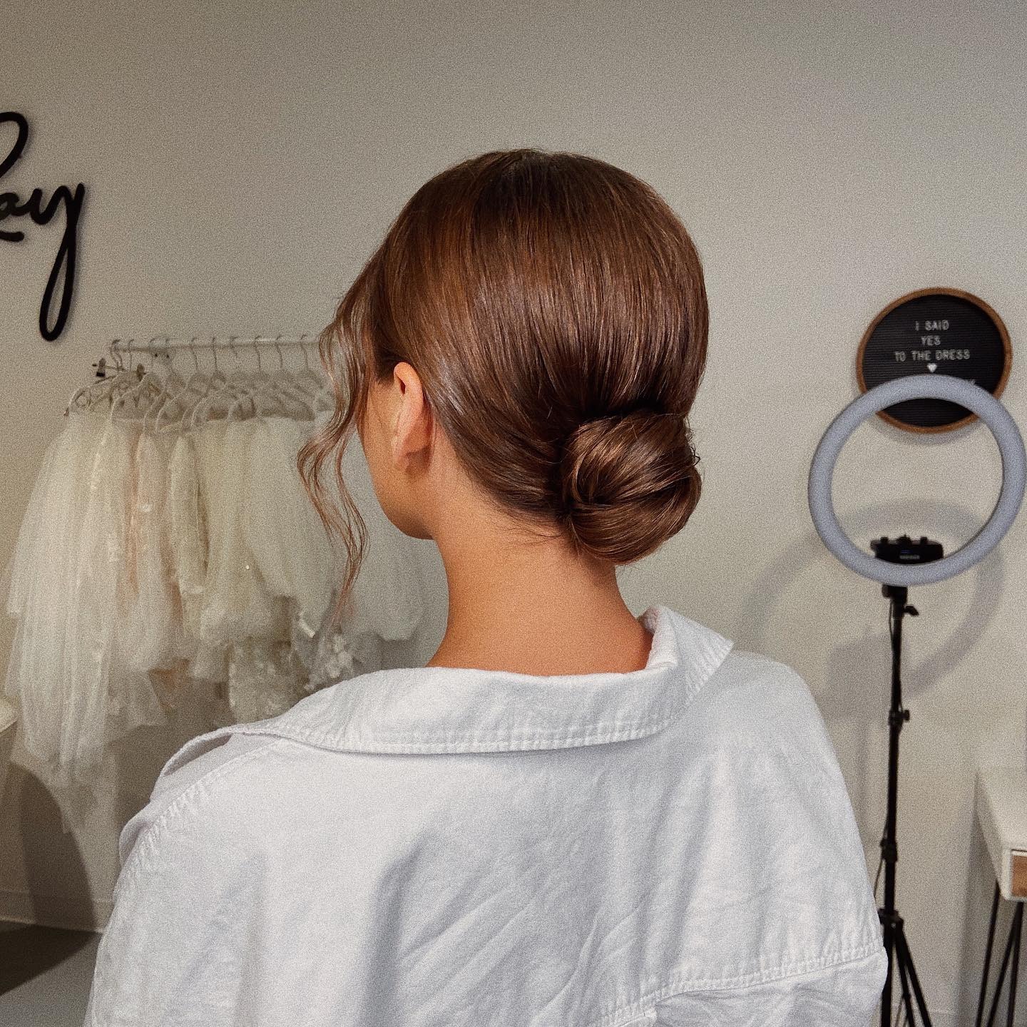 10. Classic Chestnut Brown Sleek Low Bun - Elegant Hairstyles