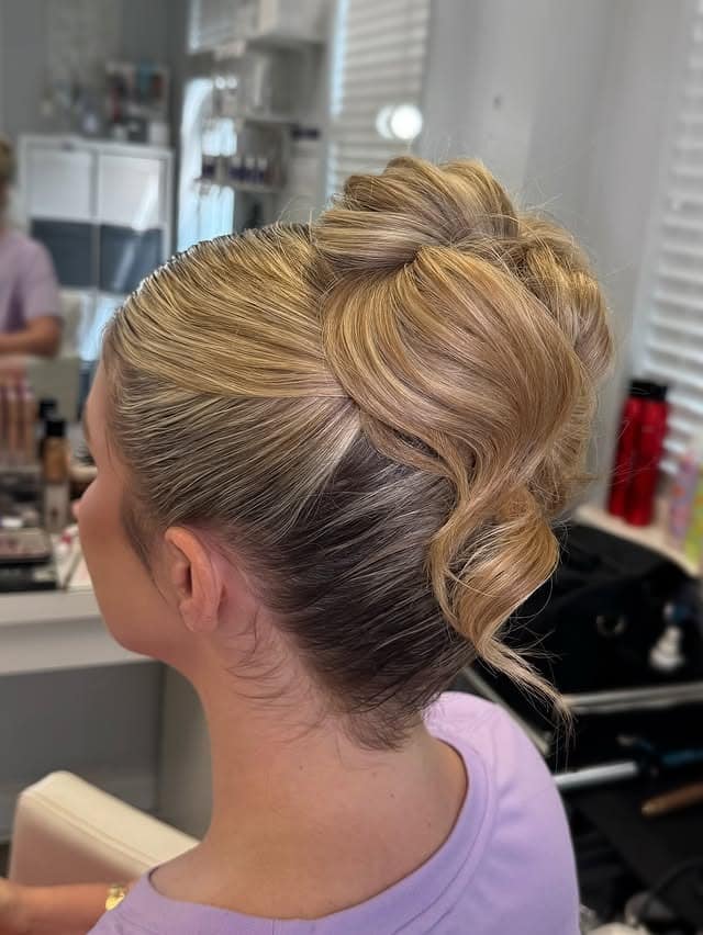 12. Golden Blonde Twisted Low Bun - Elegant Hairstyles