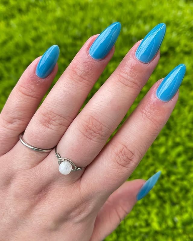 10. Sky Blue Gloss Almond Nails - nail ideas for vacation