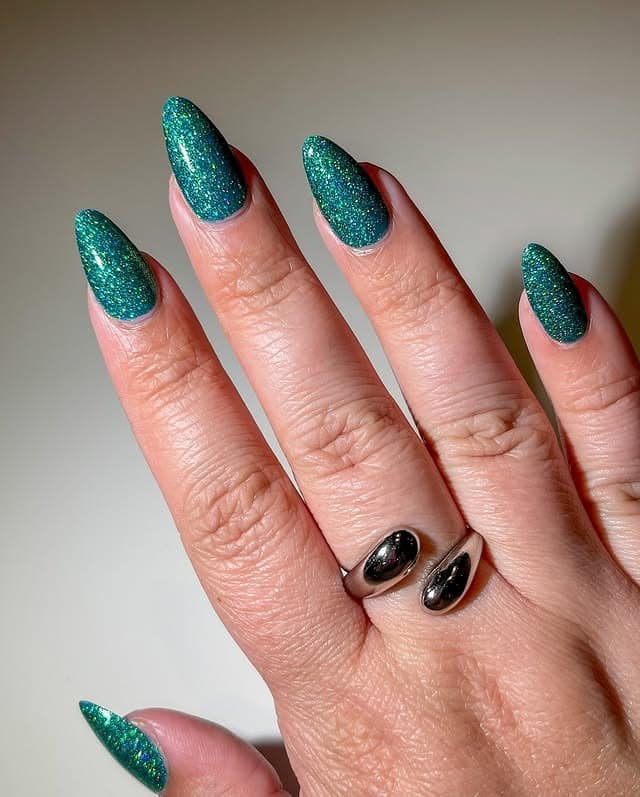 11. Emerald Green Glitter Almond Nails - nail ideas for vacation