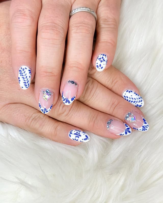 16. Blue Botanical Short Almond Nails - nail ideas for vacation