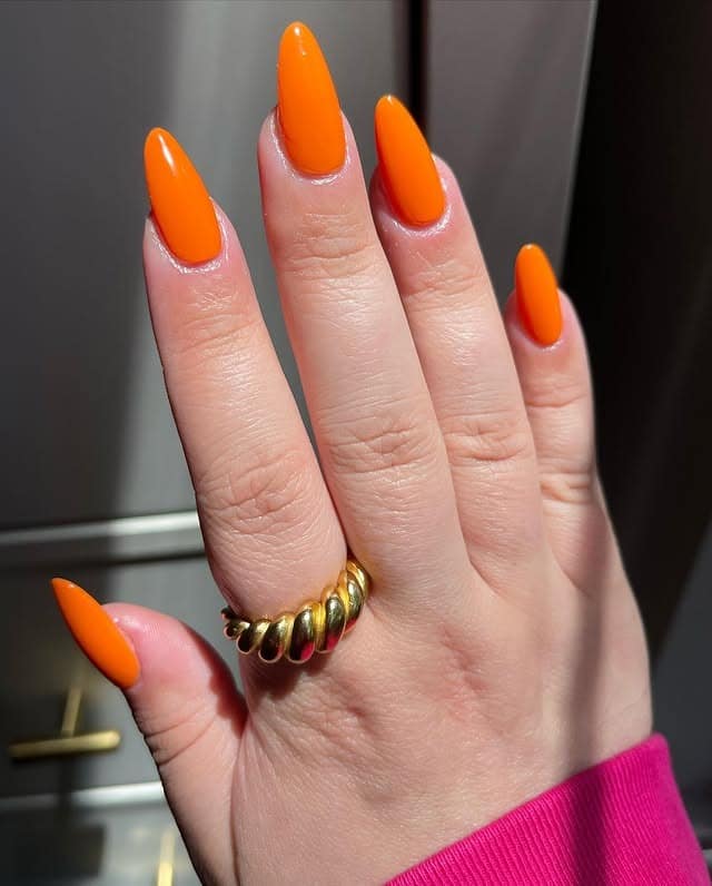 20. Bright Tangerine Gloss Almond Nails - nail ideas for vacation