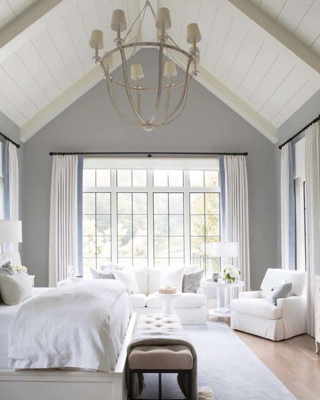 1. Vaulted White and Soft Gray Bedroom with Classic Chandelier - white bedroom ideas