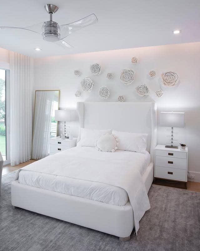 4. Modern White Bedroom with Sculptural Wall Decor - white bedroom ideas